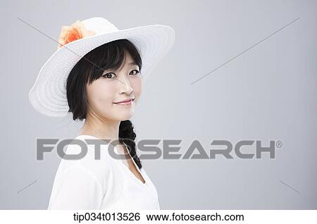 close up shot of a woman in white hat posing View Large Photo Image Stock Photograph - close up shot of a woman in white hat posing . Fotosearch