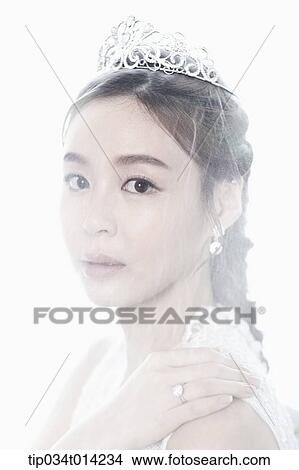 Picture - close up shot of a woman wearing wedding veils. Fotosearch