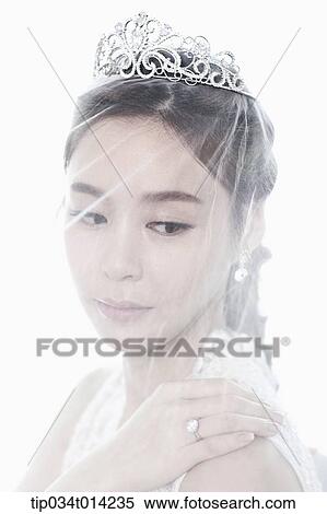 Stock Photography - close up shot of a woman wearing wedding veils. Fotosearch