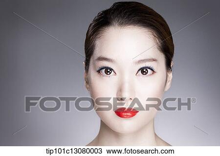 Stock Image - close up shot of a woman with red lipstick. Fotosearch