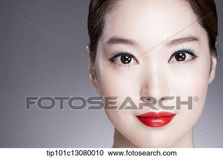 Stock Image - close up shot of a woman with red lipstick. Fotosearch