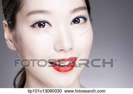close up shot of a woman with red lipstick View Large Photo Image Stock Image - close up shot of a woman with red lipstick. Fotosearch