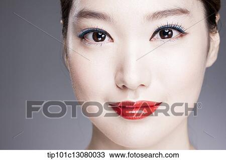Stock Image - close up shot of a woman with red lipstick. Fotosearch