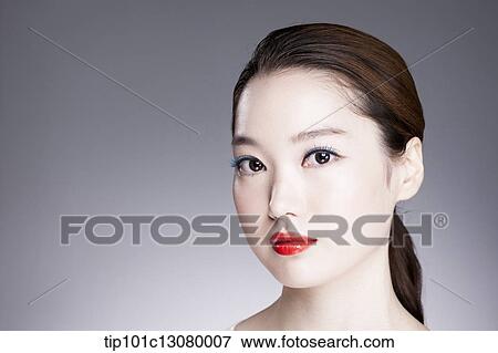 Stock Photo - close up shot of a woman with red lipstick. Fotosearch