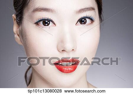 Stock Photo - close up shot of a woman with red lipstick. Fotosearch