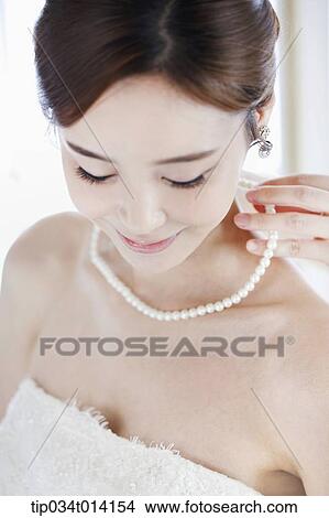 Picture - close up shot of a woman with wedding dress. Fotosearch
