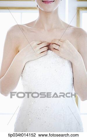 close up shot of a woman with wedding dress View Large Photo Image Stock Image - close up shot of a woman with wedding dress. Fotosearch