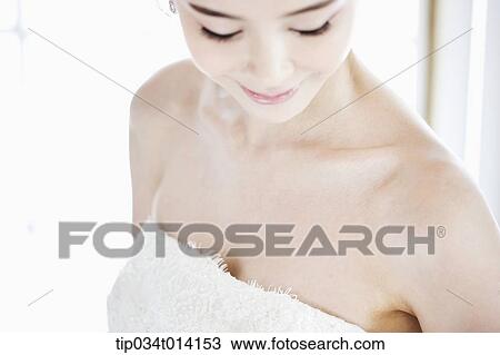 Stock Image - close up shot of a woman with wedding dress. Fotosearch