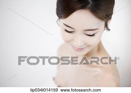 Stock Photo - close up shot of a woman with wedding dress. Fotosearch