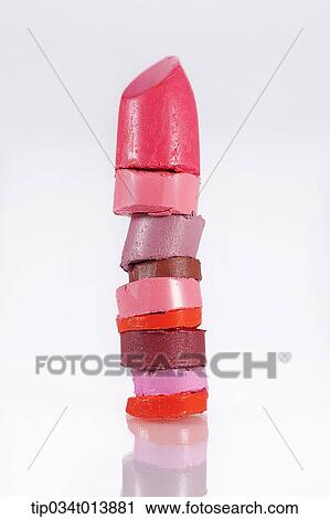 Stock Image - close up shot of pile of different colors of broken lipsticks . Fotosearch