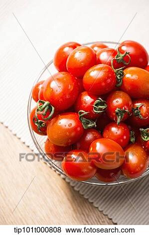 close up shot of sweet pea tomatoes in a glass bowl View Large Photo Image Stock Photo - close up shot of sweet pea tomatoes in a glass bowl. Fotosearch