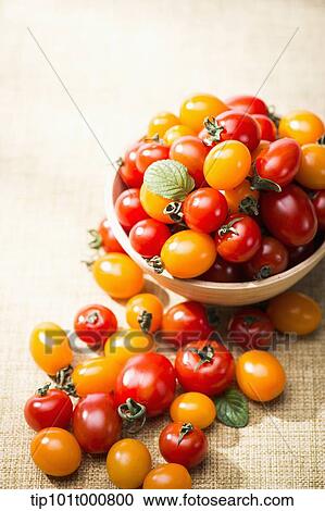 Stock Image - close up shot of sweet pea tomatoes. Fotosearch
