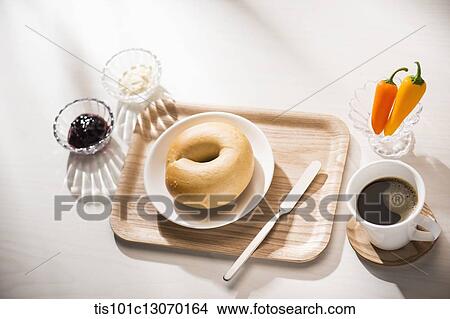 coffee and bagel on a white sheet View Large Photo Image Picture - coffee and bagel on a white sheet. Fotosearch