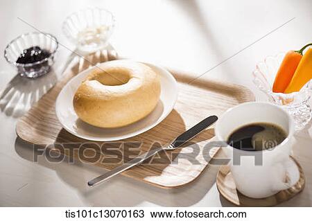 coffee and bagel on a white sheet View Large Photo Image Stock Image - coffee and bagel on a white sheet. Fotosearch
