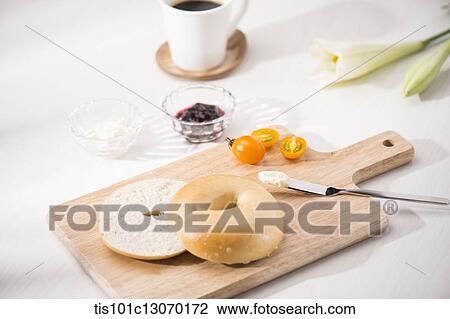 coffee and bagel on a white sheet View Large Photo Image Stock Image - coffee and bagel on a white sheet. Fotosearch