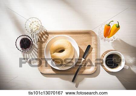 coffee and bagel on a white sheet View Large Photo Image Stock Photo - coffee and bagel on a white sheet. Fotosearch