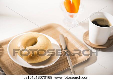 coffee and bagel on a white sheet View Large Photo Image Stock Photo - coffee and bagel on a white sheet. Fotosearch