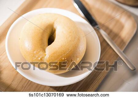 coffee and bagel on a white sheet View Large Photo Image Stock Photo - coffee and bagel on a white sheet. Fotosearch