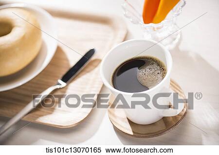 coffee and bagel on a white sheet View Large Photo Image Stock Photography - coffee and bagel on a white sheet. Fotosearch