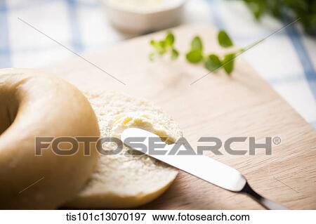 cream cheese spread on top of a bagel View Large Photo Image Stock Photo - cream cheese spread on top of a bagel. Fotosearch