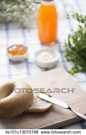 cream cheese spread on top of a bagel View Large Photo Image Stock Photo - cream cheese spread on top of a bagel. Fotosearch