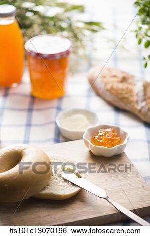 cream cheese spread on top of a bagel View Large Photo Image Stock Photograph - cream cheese spread on top of a bagel. Fotosearch