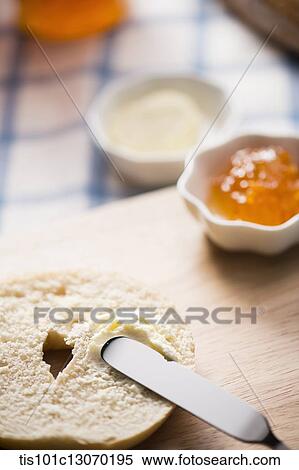 cream cheese spread on top of a bagel View Large Photo Image Stock Photography - cream cheese spread on top of a bagel. Fotosearch