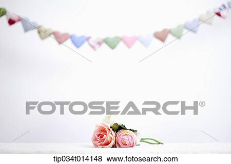 different colors of heart shapes along each other above flower View Large Photo Image Stock Photo - different colors of heart shapes along each other above flower. Fotosearch
