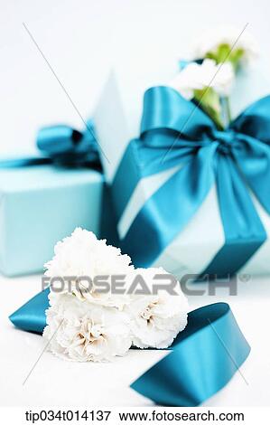 Stock Photo - flowers with gift boxes . Fotosearch