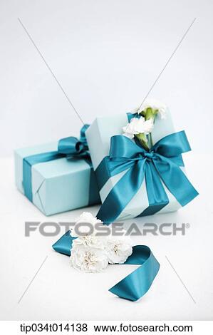 Stock Photo - flowers with gift boxes . Fotosearch