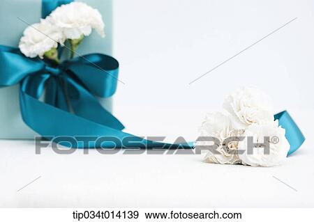 Stock Photo - flowers with gift boxes . Fotosearch