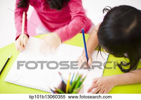 girls drawing on a sketchbook View Large Photo Image Stock Photography - girls drawing on a sketchbook. Fotosearch