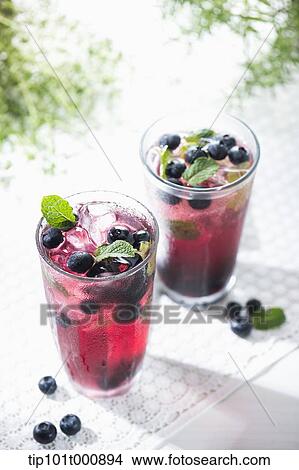 glasses of berry juice with blue berries View Large Photo Image Picture - glasses of berry juice with blue berries . Fotosearch
