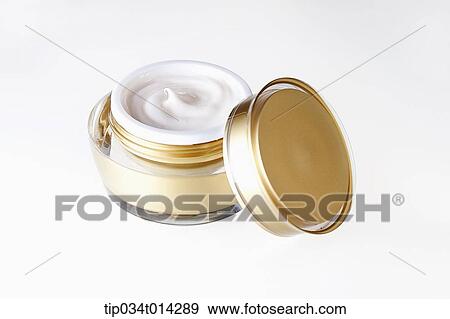 Stock Photo - golden make up case in white background. Fotosearch