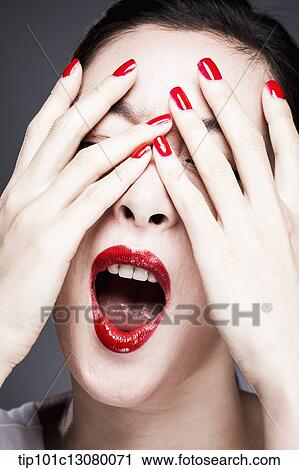 hands with red nail polish cover woman's eyes View Large Photo Image Stock Image - hands with red nail polish cover woman's eyes. Fotosearch