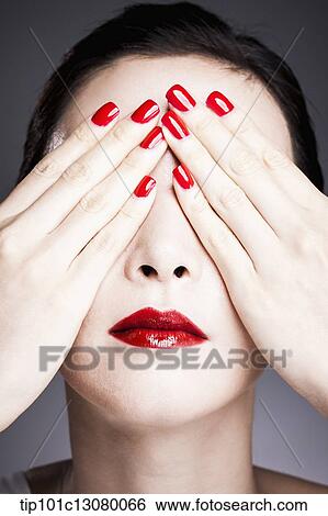hands with red nail polish cover woman's eyes View Large Photo Image Stock Photograph - hands with red nail polish cover woman's eyes. Fotosearch