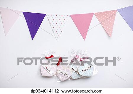 Stock Image - heart shape cookies under flags . Fotosearch