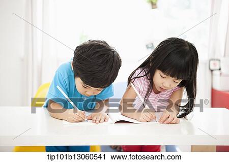 kids at desk learning together View Large Photo Image Stock Image - kids at desk learning together. Fotosearch