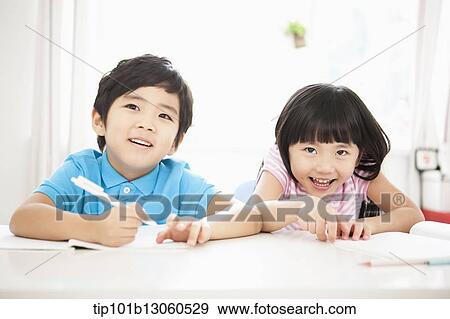 kids at desk learning together View Large Photo Image Stock Photo - kids at desk learning together. Fotosearch