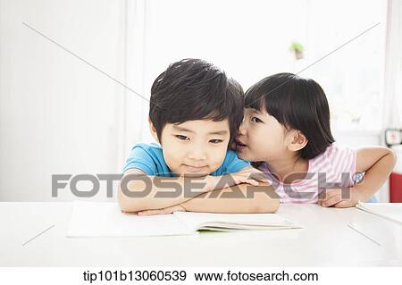 Stock Photo - kids at desk learning together. Fotosearch