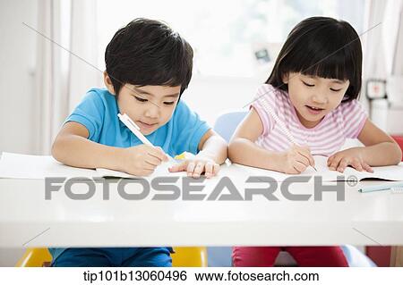 kids at desk learning together View Large Photo Image Stock Photograph - kids at desk learning together. Fotosearch