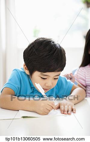 Stock Photography - kids at desk learning together. Fotosearch