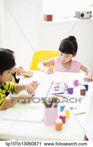 kids at table with sketchbooks and crayons View Large Photo Image Stock Image - kids at table with sketchbooks and crayons. Fotosearch