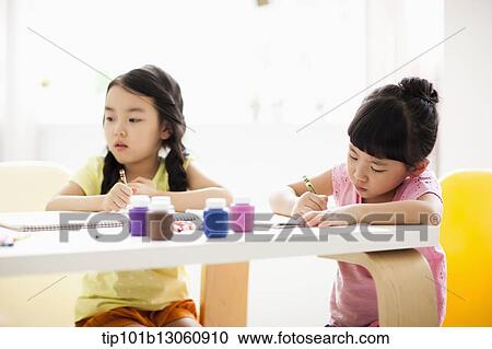 kids at table with sketchbooks and crayons View Large Photo Image Stock Image - kids at table with sketchbooks and crayons. Fotosearch