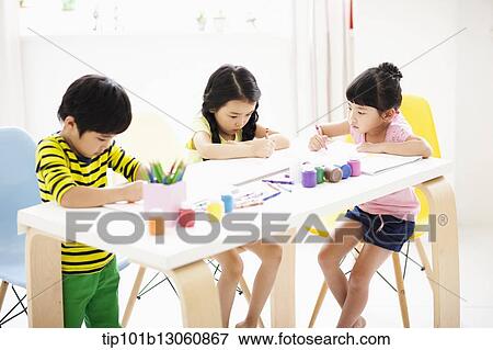 kids at table with sketchbooks and crayons View Large Photo Image Stock Photo - kids at table with sketchbooks and crayons. Fotosearch