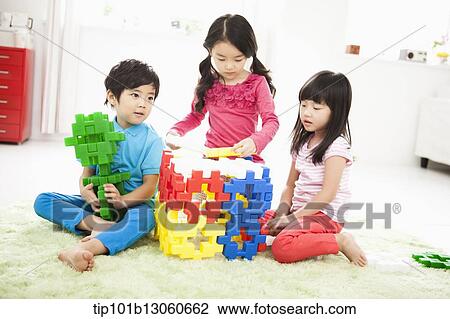 Stock Image - kids building toy blocks. Fotosearch