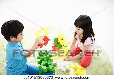 Stock Image - kids building toy blocks. Fotosearch