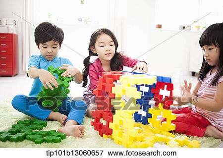 Stock Photo - kids building toy blocks. Fotosearch
