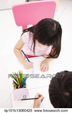 kids drawing on a sketchbooks View Large Photo Image Stock Photography - kids drawing on a sketchbooks. Fotosearch