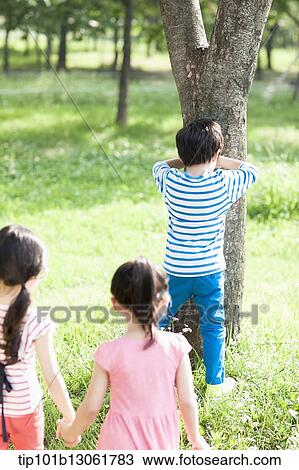 Stock Image - kids playing in the nature. Fotosearch